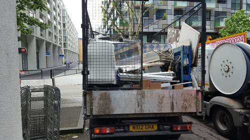 Office furniture being carefully removed during clearance